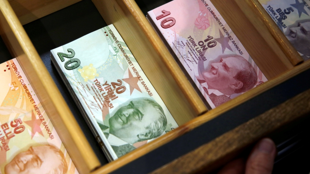 FILE PHOTO: Turkish lira banknotes are pictured at a currency exchange office in Istanbul