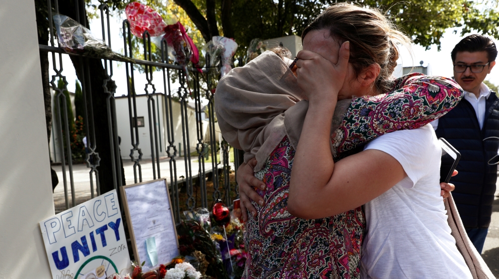 Mourners gathered outside Al Noor mosque on Saturday [Edgar Su/Reuters]