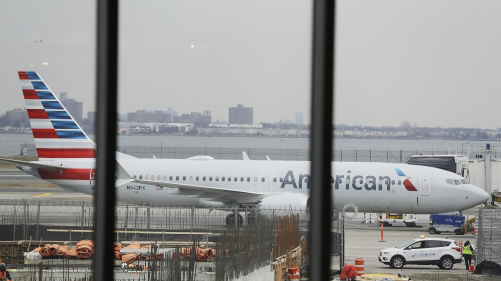 An American Airlines Boeing 737 MAX 8 plane sits at a boarding gate at LaGuardia Airport Wednesday, March 13, 2019, in New York.