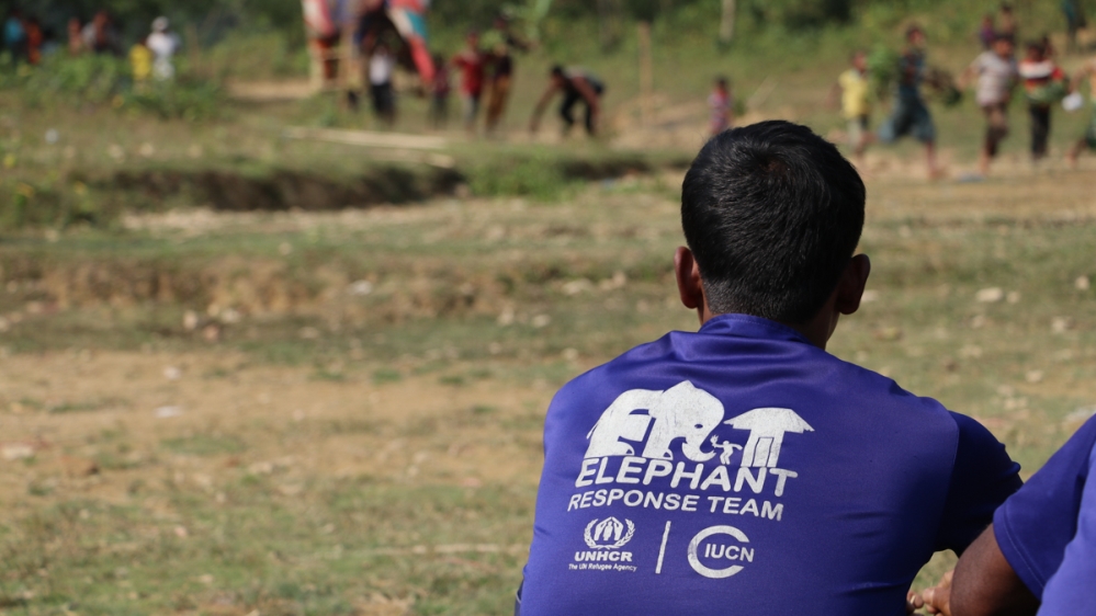 People recognise the tusk force because of their t-shirts and often approach them for help or to report an elephant sighting [Susannah Savage/Al Jazeera]