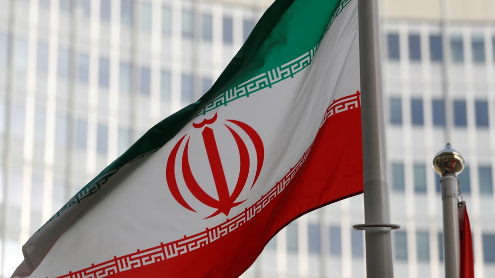The Iranian flag flutters in front the International Atomic Energy Agency (IAEA) headquarters in Vienna