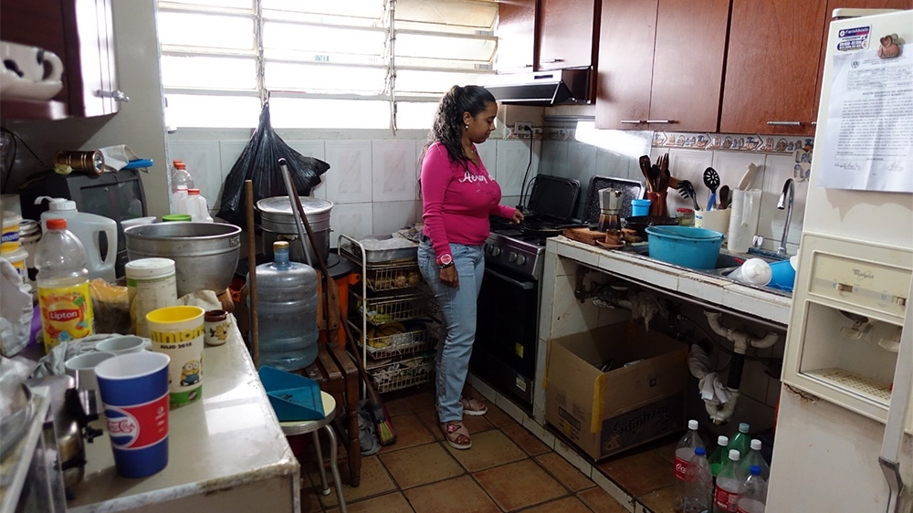 'Since 2014 we've been having issues with the water supply, but now it's way worse,' Yoana De Oliveira said [Elizabeth Melimopoulos/Al Jazeera]