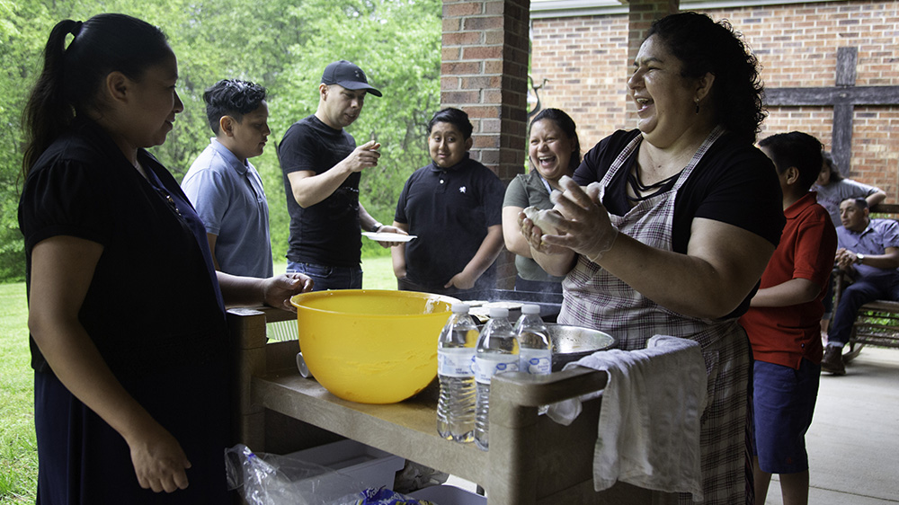 Juana makes papusas for friends and family at St Barnabas Episcopal Church almost two years after seeking sanctuary [Bridgette Cyr/Al Jazeera]