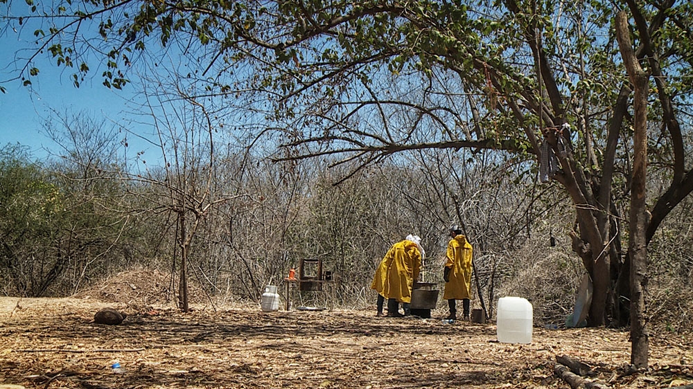 Three members of the Sinaloa Cartel manufacture synthetic heroin [John Holman/Al Jazeera]
