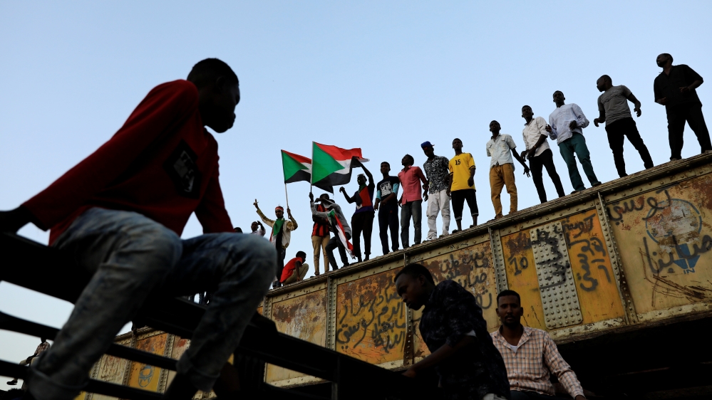 Sudanese protesters attend a demonstration in front of the defense ministry compound in Khartoum
