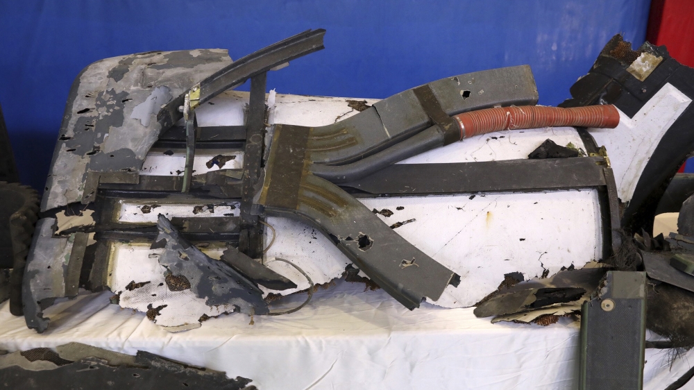 Debris from what Iran's Revolutionary Guard aerospace division describes as the U.S. drone which was shot down on Thursday is displayed in Tehran, Iran, Friday, June 21, 2019. Major airlines from aro