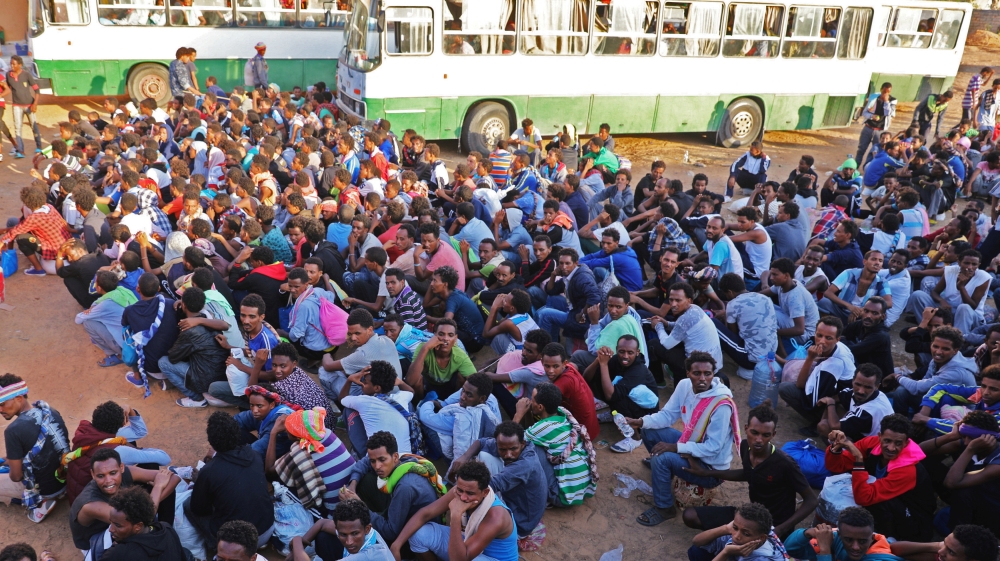 Migrants are seen after they were relocated from government-run detention centers, after getting trapped by clashes between rival groups in Tripoli