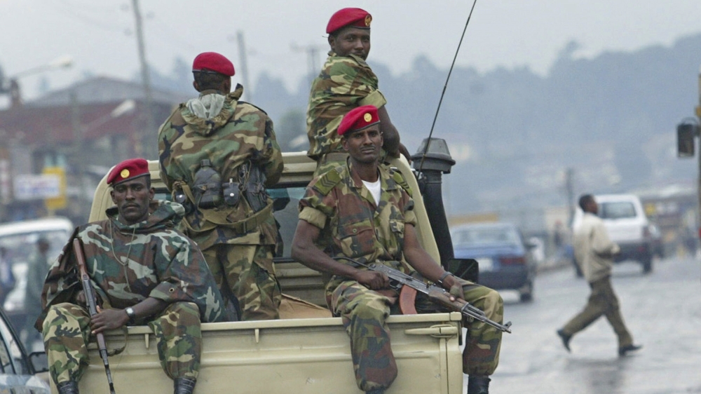 FILE - In this Friday, June 10, 2005 file photo, members of the Ethiopian army patrol the streets of Addis Ababa. The Ethiopian government has declared a state of emergency effective immediately follo