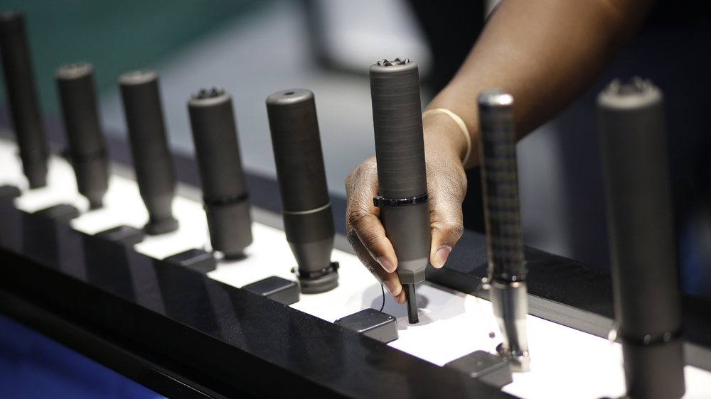 Silencers are on display at the Sig Sauer booth