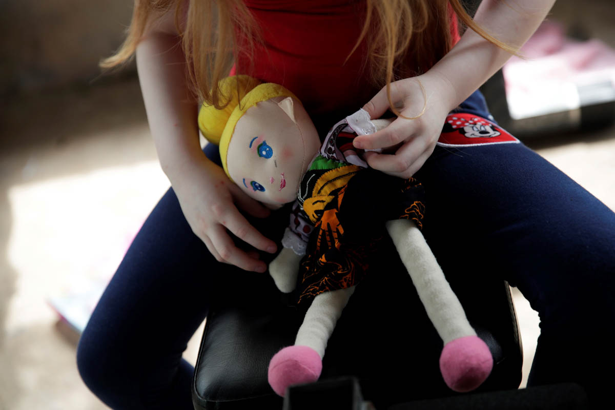 Brenda Hawkins, aged 6, plays with her albino doll at her house in the Panama Oeste province, Panama, 05 June 2019. The indigenous Guna people, one of seven ethnic groups in Panama, have a population