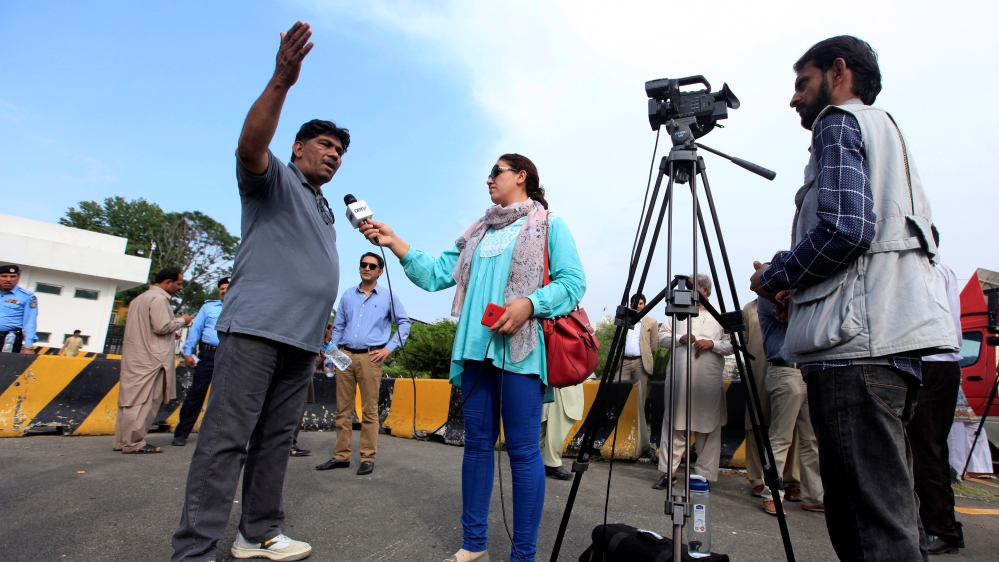 Journalists work during a demonstration to mark World Press Freedom Day in Islamabad