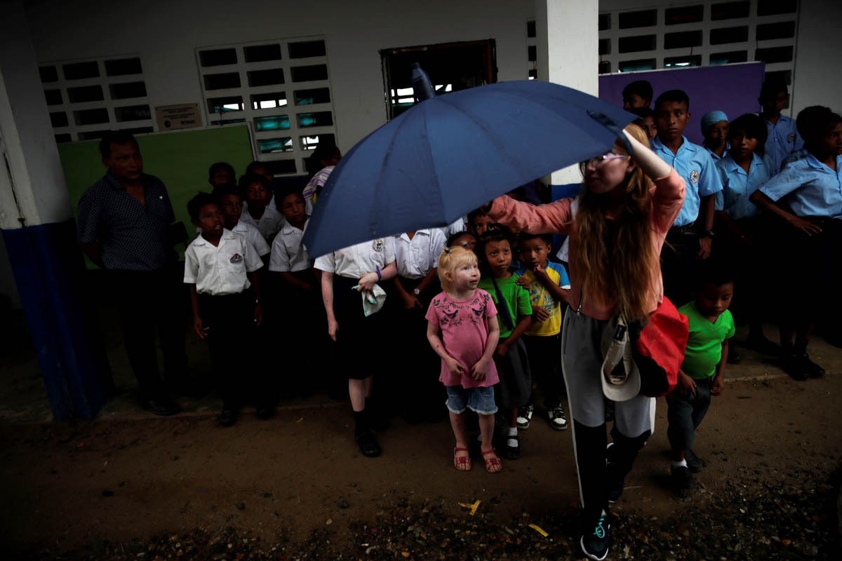 Loidibeth Alfaro (front, L), aged 5, shelters from the rain at a school on the Gardi Sugdub island, in the Guna Yala region, Panama, 11 June 2019. The indigenous Guna people, one of seven ethnic group