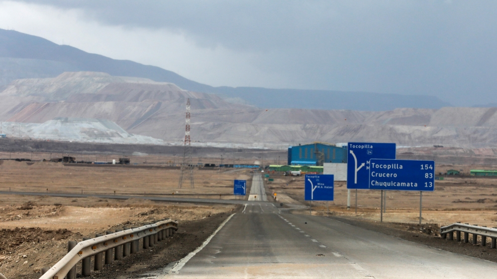 A hole in the road is seen after heavy rains hit north of Chile near Calama