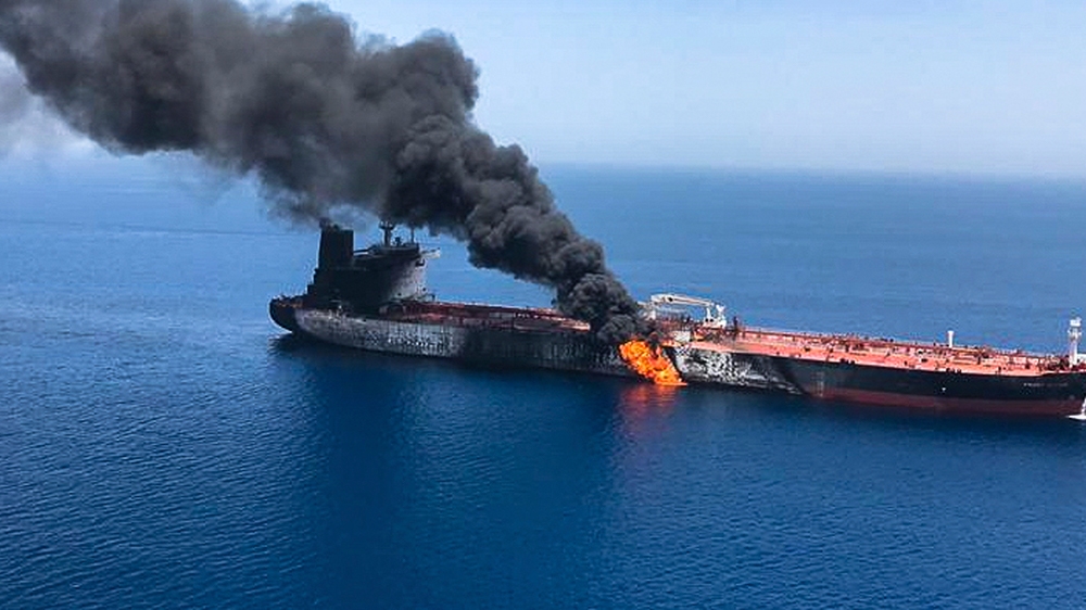 An oil tanker is on fire in the sea of Oman, Thursday, June 13, 2019. Two oil tankers near the strategic Strait of Hormuz were reportedly attacked on Thursday, an assault that left one ablaze and adri