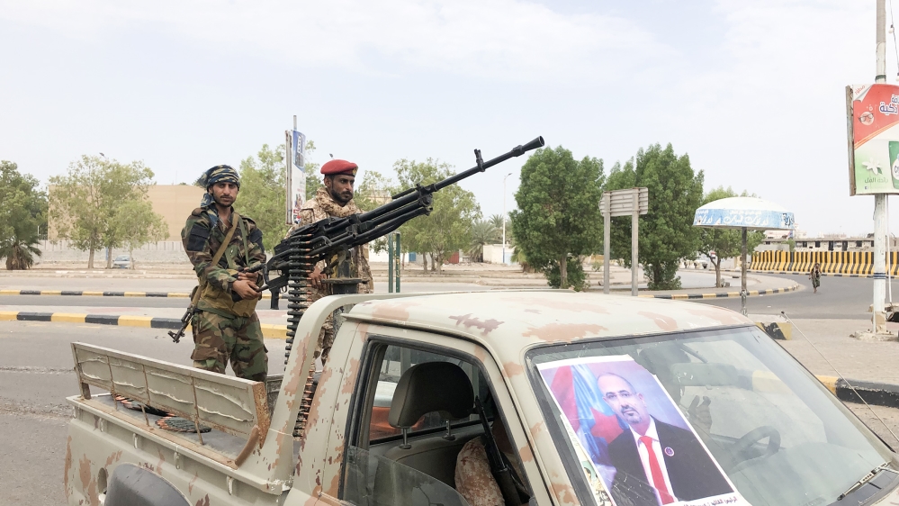 Fighters of the UAE-trained Security Belt Force, dominated by members of the Southern Transitional Council (STC) which seeks independence for south Yemen, patrol a street in an area near the Aden Inte