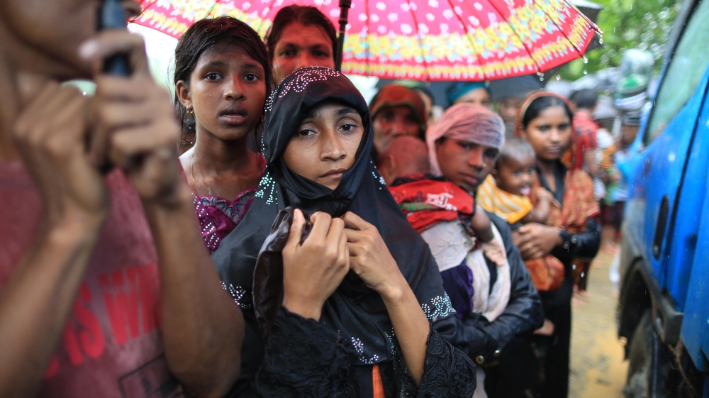 Rohingya refugees wait to receive aid in Cox''s Bazar, Bangladesh. [Showkat Shafi/Al Jazeera]
