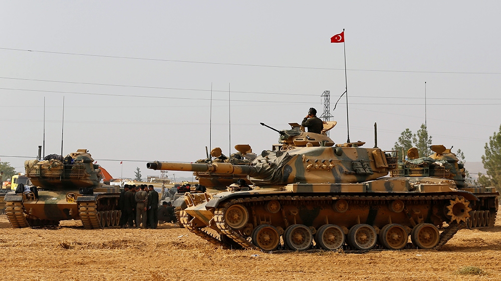 Turkish army tanks and military personal are stationed in Karkamis on the Turkish-Syrian border in the southeastern Gaziantep province, Turkey, August 25, 2016. REUTERS/Umit Bektas/File Photo -