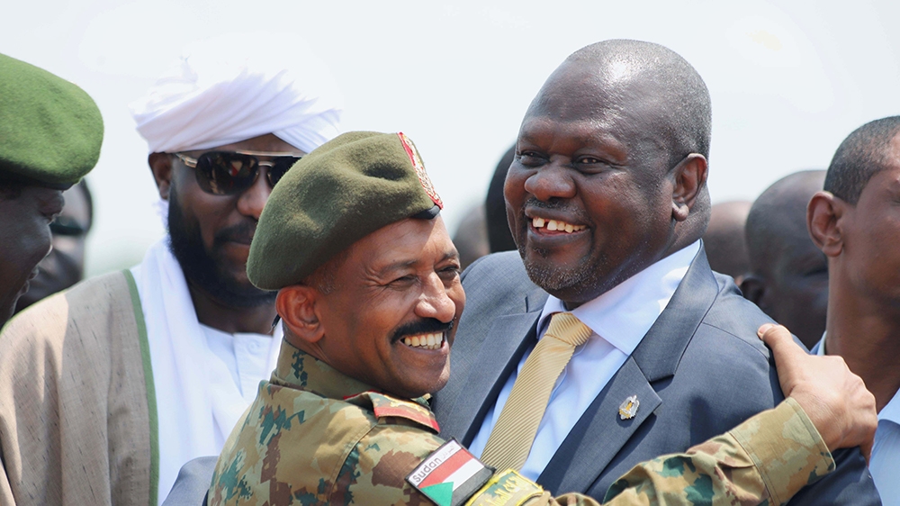 South Sudan''s ex-vice president and former rebel leader Riek Machar is greeted by a Sudanese army officer as he arrives to Juba to meet South Sudanese President Salva Kiir, at the Juba international a