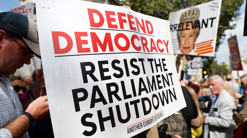 Anti Brexit protesters from 'Stop the Coup' movement demonstrate outside Downing Street in London, Saturday, Aug. 31, 2019. Political opposition to Prime Minister Boris Johnson's move to suspend Parli