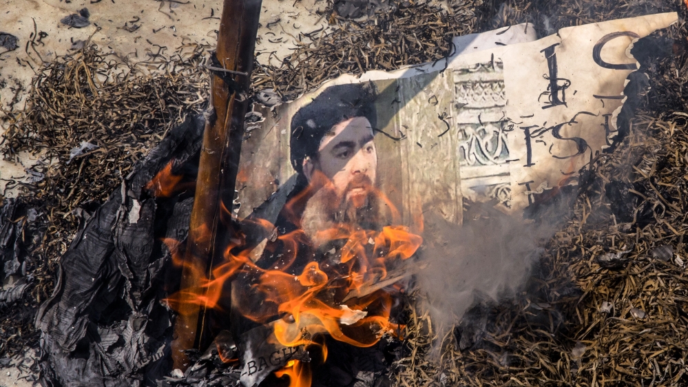 Shiite Muslims burn an effigy of the leader of the Islamic State group, Abu Bakr al-Baghdadi during a protest in New Delhi, India, Friday, June 9, 2017. The protest was against the Wednesday Islamic S