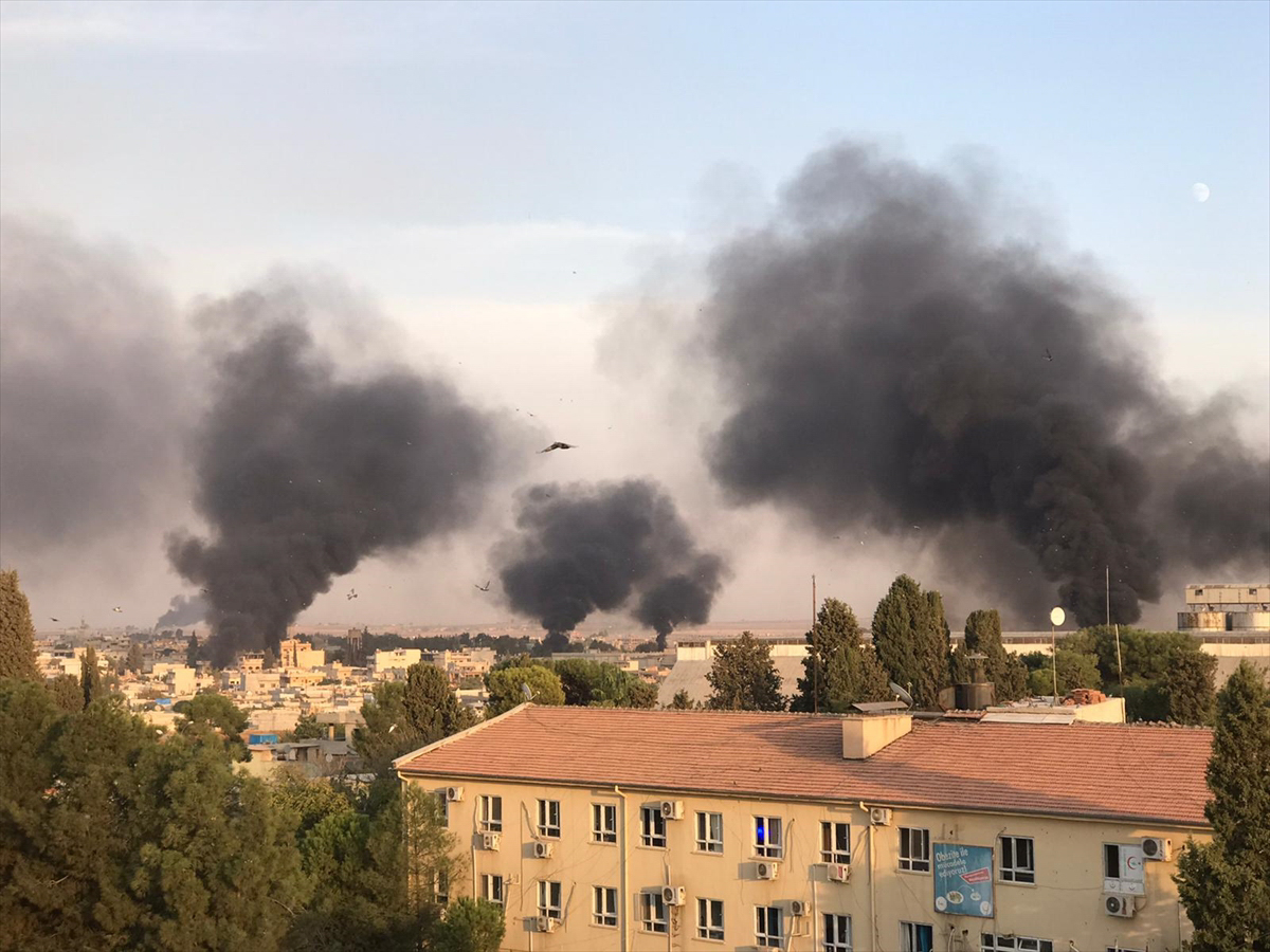 SANLIURFA, TURKEY - OCTOBER 09: A photo taken from Turkey''s Sanliurfa province, on October 09, 2019 shows smoke rises at the site of Ras al-Ayn city of Syria as Turkish troops along with the Syrian Na