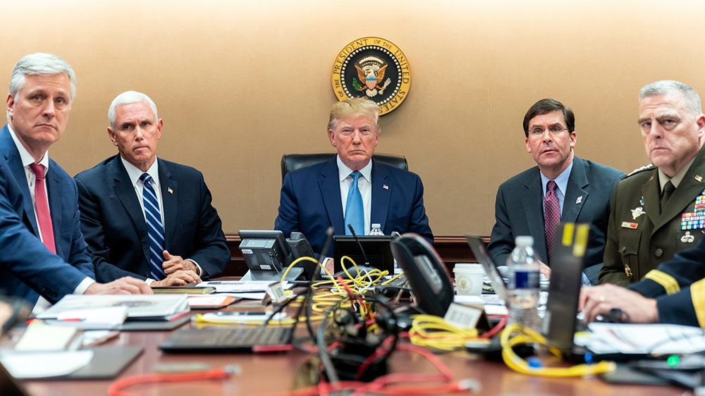 In this image released by the White House, President Donald Trump is joined by Vice President Mike Pence, second from left, national security adviser Robert O’Brien, left; Secretary of Defense Mark Es