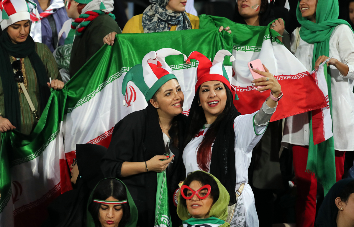 Iranian women cheer during the FIFIA World Cup qualification match between Iran and Cambodia, at the Azadi stadium in Tehran, Iran, 10 October 2019. Media reported that thousands of Iranian women are