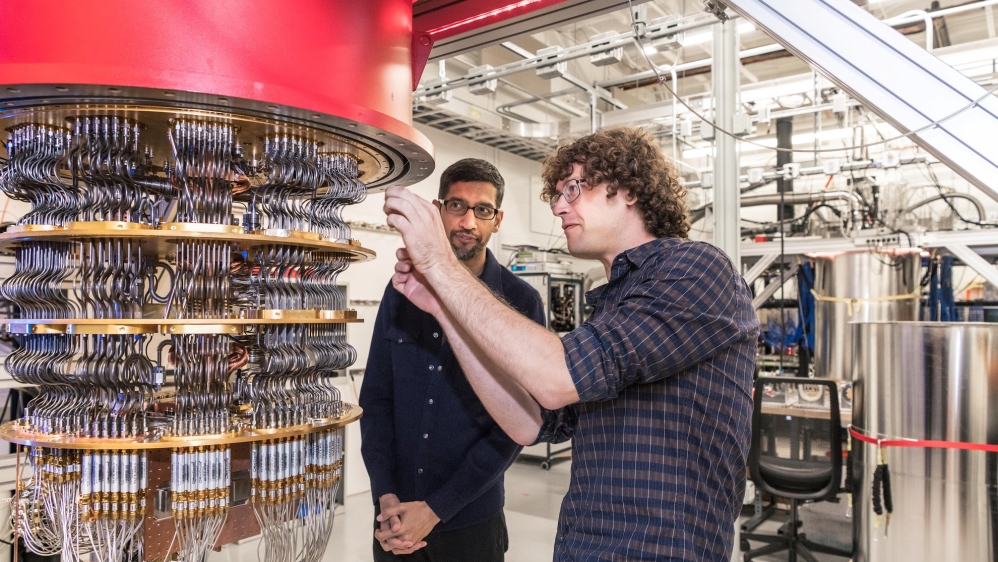 A handout picture shows Pichai and Sank with one of Google''s Quantum Computers in the Santa Barbara lab