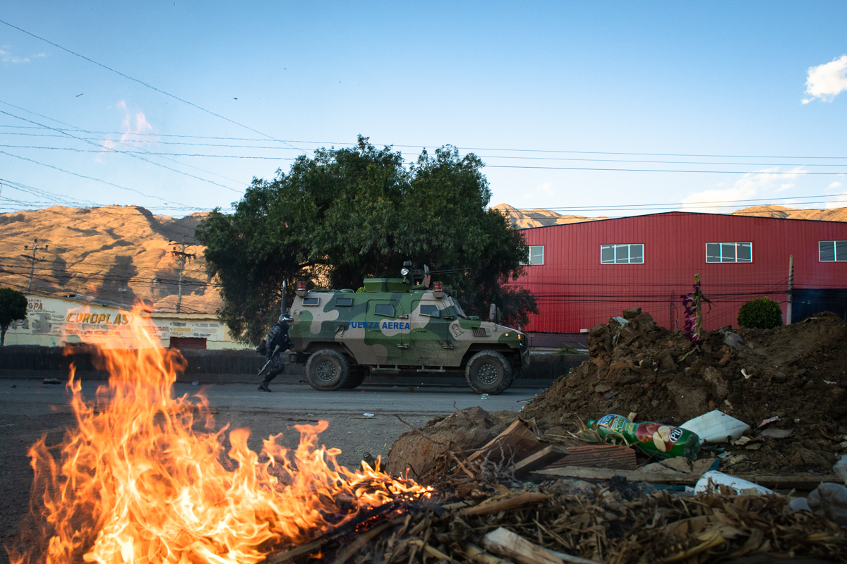 Antiriot police move towards demonstrators after violence erupted during a demonstration by supporters of Evo Morales. Over 3,000 protesters demanded access to Cochabamaba where they intended to deman