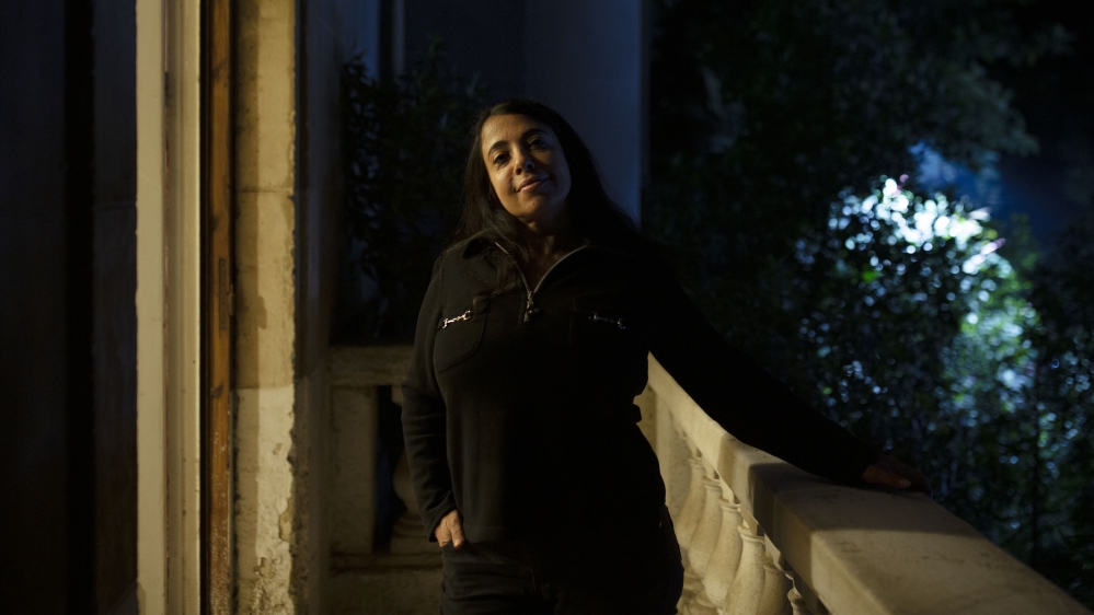 In this Monday, Nov. 11, 2019 photo, human rights lawyer Hoda Nasrallah poses for a portrait at her office in Cairo, Egypt.