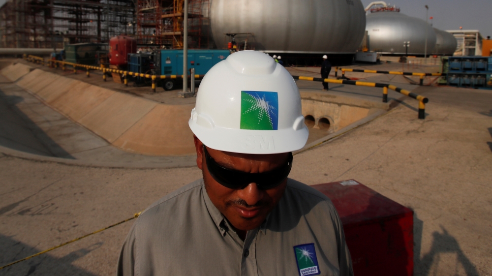 An employee in a branded helmet is pictured at Saudi Aramco oil facility in Abqaiq