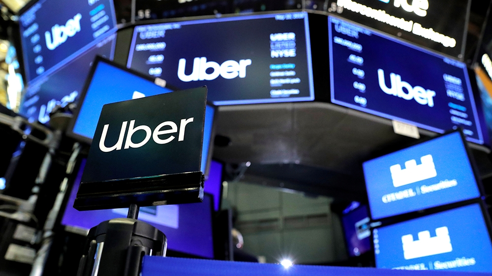 Uber Technologies Inc. logos are seen on screens on the trading floor of the New York Stock Exchange (NYSE) during the company''s IPO in New York, U.S., May 10, 2019