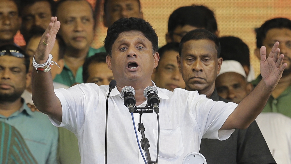 Presidential candidate of Sri Lanka's governing party Sajith Premadasa, center, speaks during his maiden election campaign rally in Colombo, Sri Lanka, Thursday, Oct. 10, 2019. Premadasa says he will
