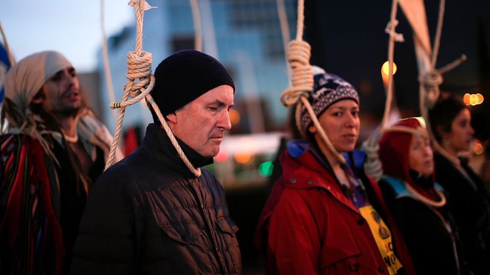 Activists protest outside of the COP25 climate talks congress in Madrid, Spain, Saturday, Dec. 14, 2019. The United Nations Secretary-General has warned that failure to tackle global warming could res