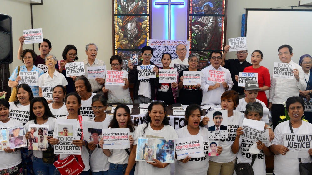 Activists and families of drug war victims display placards during a protest against the war on drugs by President Rodrigo Duterte in Quezon city