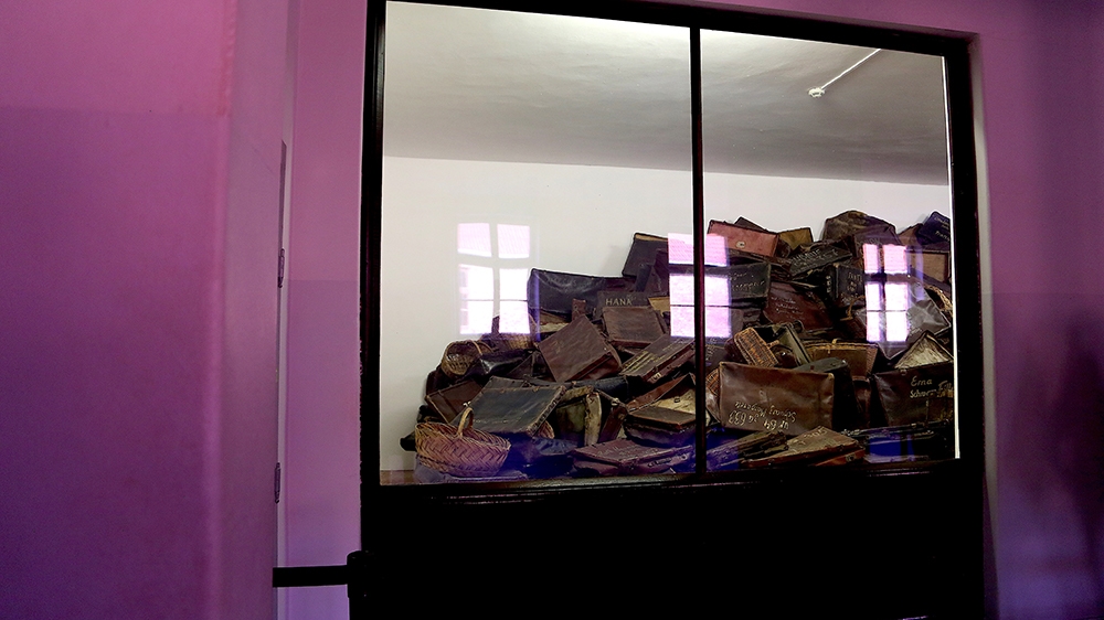 At the Auschwitz-Birkenau Memorial and Museum, a display shows suitcases stolen from people deported to the camp complex by the German Nazis. The camp complex was liberat-ed on January 27, 1945. [Veró