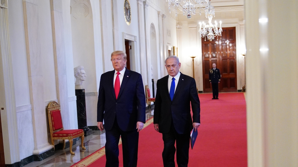 US President Donald Trump and Israeli Prime Minister Benjamin Netanyahu arrive for an announcement of Trump''s Middle East peace plan in the East Room of the White House in Washington, DC on January 28
