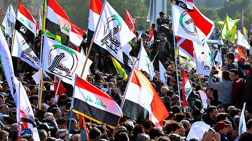 Mourners gather during a funeral procession for Abu Mahdi al-Muhandis, deputy commander of Iran-backed militias in Basra, Iraq, Tuesday, Jan. 7, 2020. Thousands of people gathered in Basra on Tuesday 