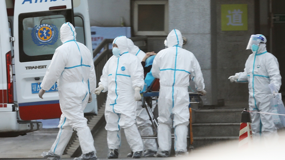 Medical staff transfer patients to Jinyintan hospital where patients infected with a new strain of Coronavirus identified as the cause of the Wuhan pneumonia outbreak are treated in Wuhan, Hubei provi