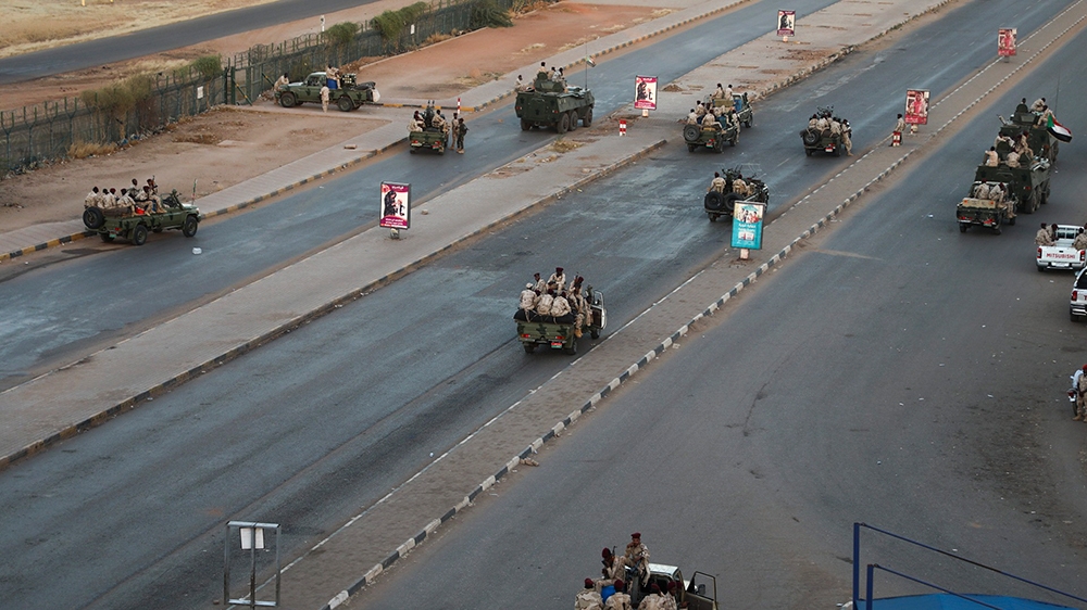 Members of the Rapid Support Forces, a paramilitary force operated by the Sudanese government, block roads in Khartoum, Sudan, Tuesday, Jan. 14, 2020. A Sudanese official said Tuesday that security fo