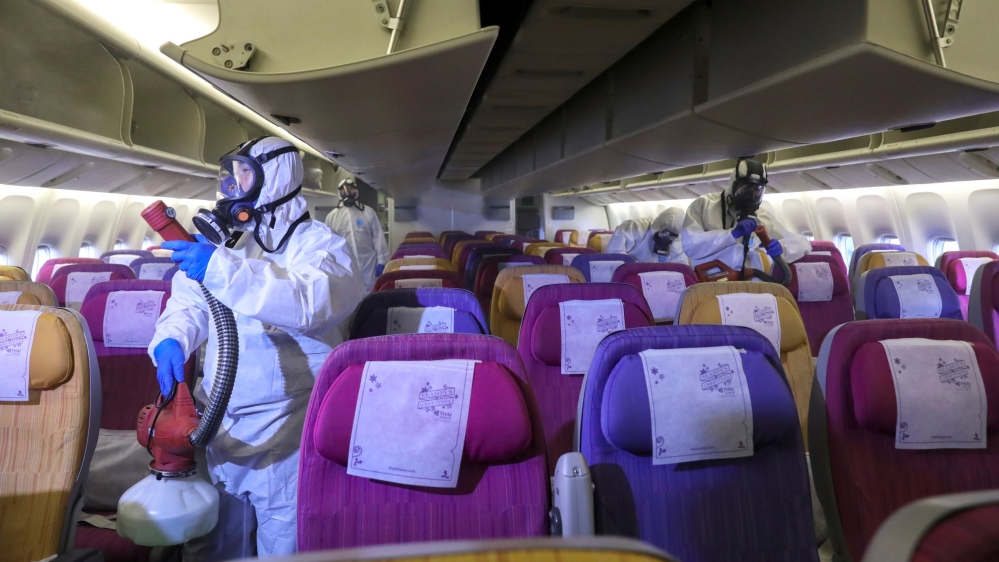 Thai Airways crew disinfect the cabin / coronavirus