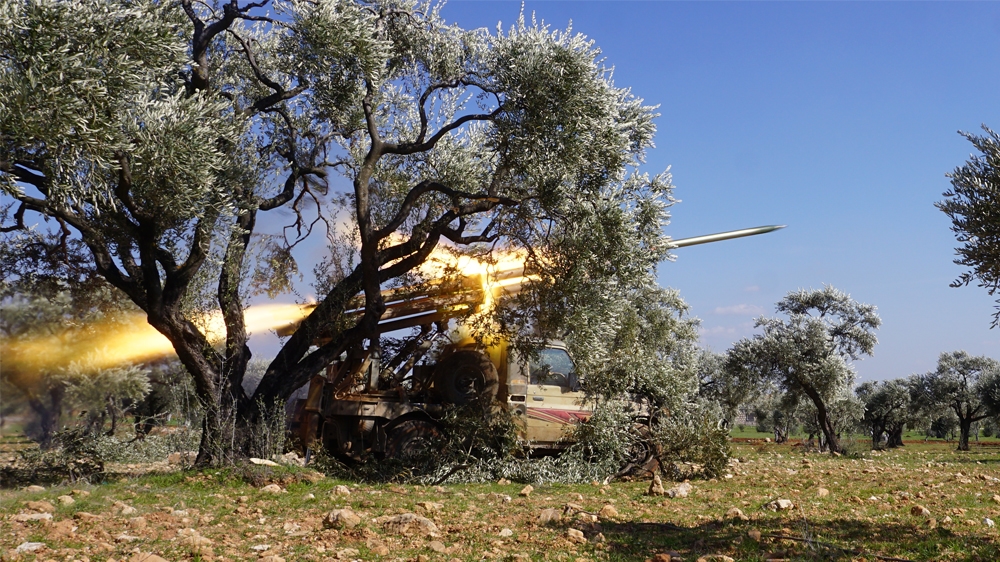 SYRIA-CONFLICT-IDLIB Members of Syria's opposition National Liberation Front remotely-fire a rocket at a position near the village of al-Nayrab, about 14 kilometres southeast of the city of Idlib 