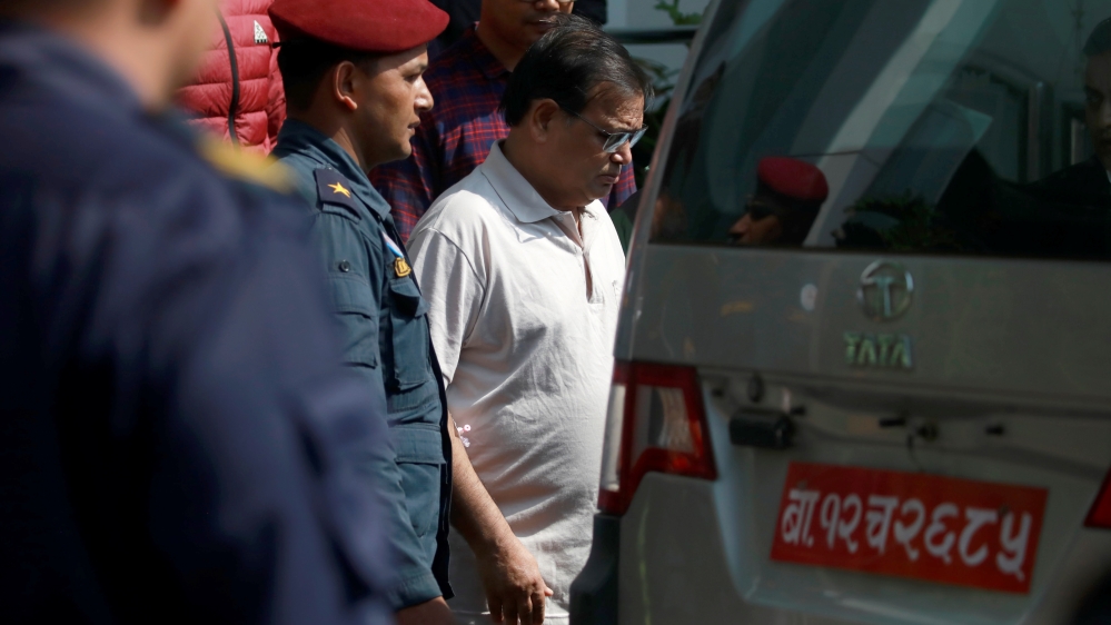 Krishna Bahadur Mahara (C) who resigned from his post as a speaker of the House of Representatives in Nepal''s parliament after an accusation made by a female parliament employee that he raped her, hea