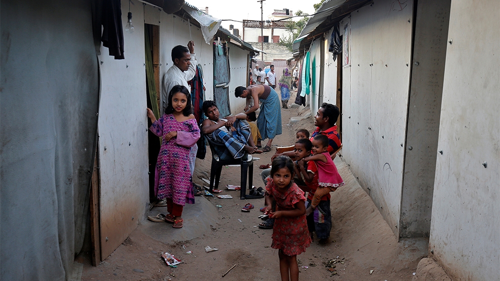 People belonging to Rohingya Muslim community sit outside their makeshift houses on the outskirts of Jammu, May 5, 2017. Picture taken on May 5, 2017. REUTERS/Mukesh Gupta