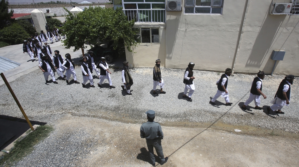 Afghan prisoners prepare to be released from Pul-e-Charkhi prison, in Kabul, Afghanistan, Thursday, June 14, 2018. The Afghan president pardoned 185 prisoners loyal to Gulbuddin Hekmatyar, a former wa
