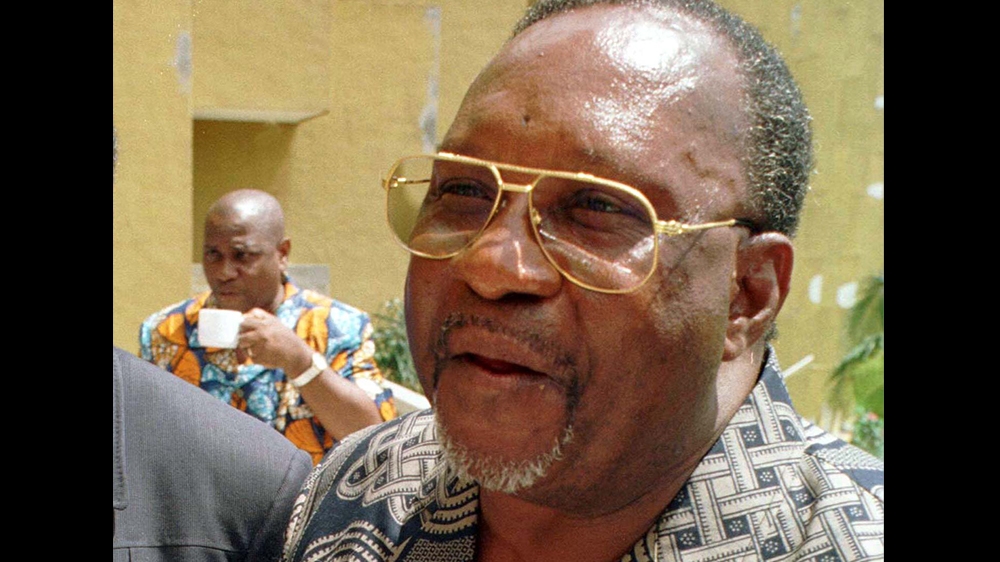Former Congo Republic leader, Jacques-Joachim Yhomby-Opango, speaks to reporters while in exile in Ivory Coast October 28. Yhomby Opango, a former prime-minister, put his name to a call by the ousted