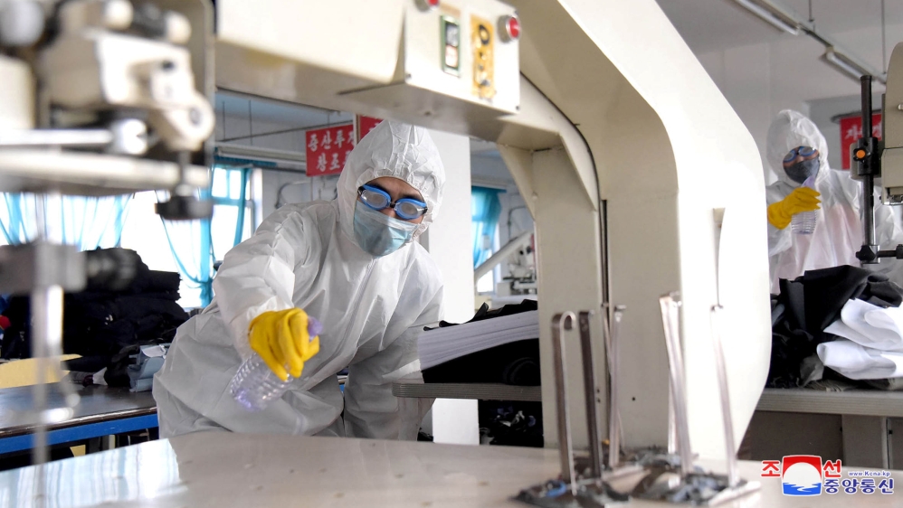 KCNA picture of volunteers carrying out disinfection work during an anti-virus campaign in Pyongyang