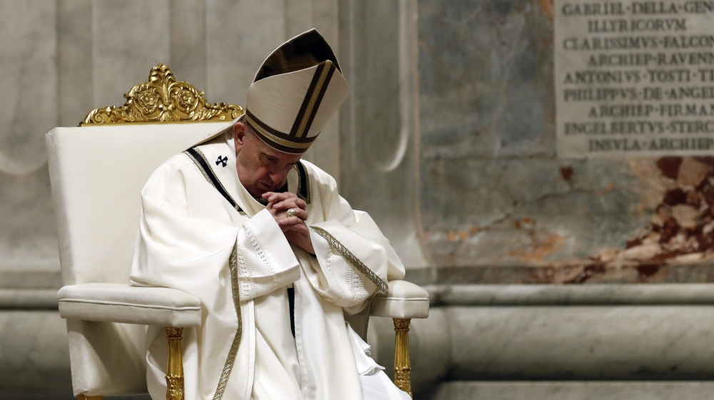 epa08357968 Pope Francis leads the Easter Vigil Mass in St. Peter's Basilica, behind closed door due to the outbreak of the coronavirus disease (COVID-19) at the Vatican, 11 April 2020.  EPA-EFE/REMO 
