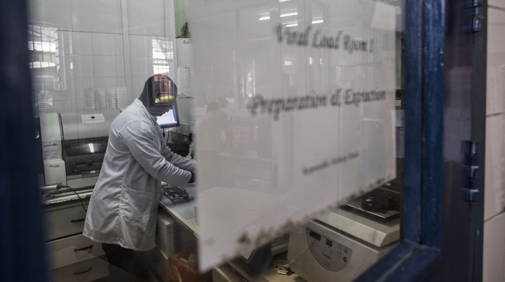 A lab technician works inside the viral load room at the Thyolo District hospital on November 26, 2014. The World Health Organization (WHO) says there were some 35 million people around the world livi