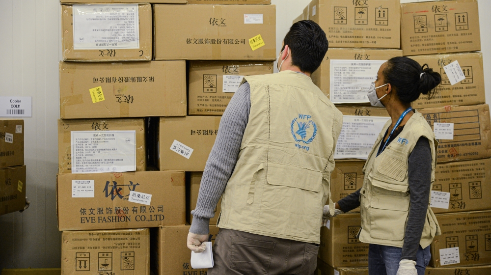 Staff of the World Food Programme (WFP) check arrived boxes, mostly personal protective equipment (PPE), at Ethiopian Airlines'' cargo facility at the Bole International Airport in Addis Ababa, Ethiopi
